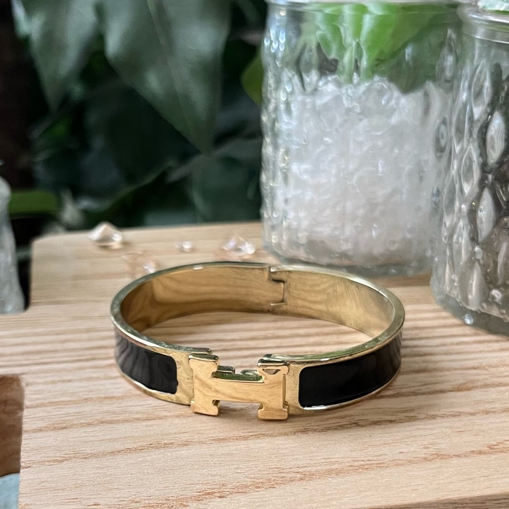Gold and Black “H” Click Women’s Bracelet